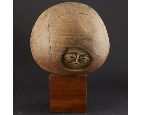 Joel Edwards. Ceramic globe sculpture with faces. Includes wooden stand.Note: Portion of the proceeds from this lot will be d