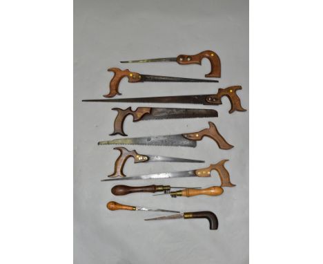 A BOX CONTAINING ELEVEN VINTAGE SAWS, including five compass saws by makers such as I &amp; H Sorby, four pad saws, etc (11)