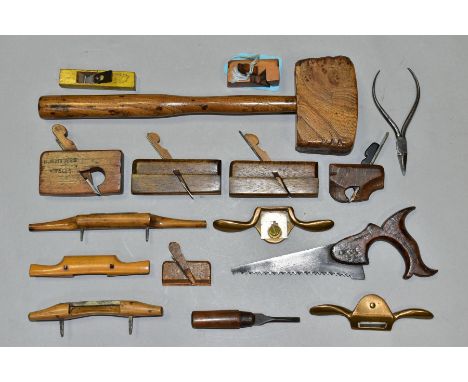 A SMALL TRAY CONTAINING MINIATURE CARPENTERS TOOLS including ½'' shoulder plane 2½'' long, a 1½'' long moulding plane, a 2¼''