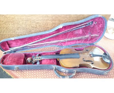 A late 19th century violin bearing internal Antonius Stradivarius label together with two bows.