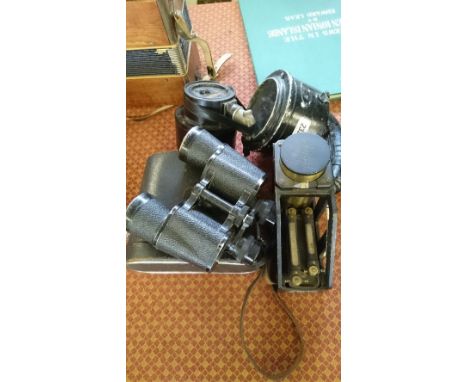 A black painted WWII morse code signal light together with a Clinc meter inspectors 45 degrees MK III admiralty pattern No.25