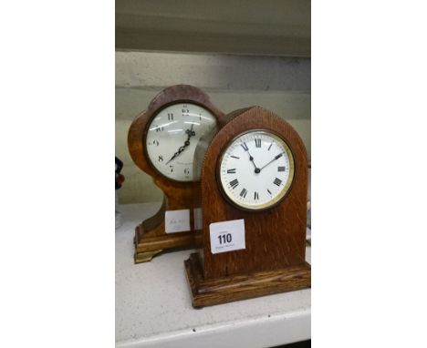 An oak cased early 20th century mantle clock together with a Comitti mantle clock with battery operated movement.