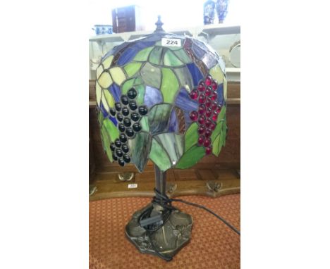 A small Tiffany style table lamp and shade.