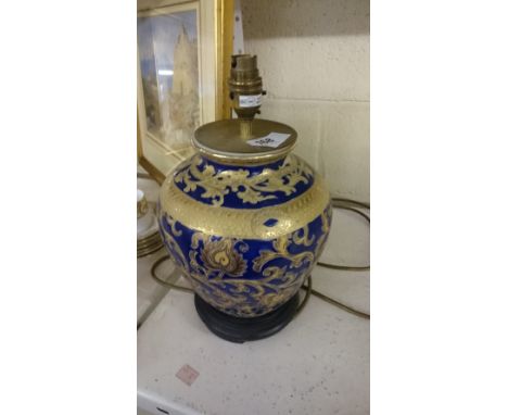 A pair of china lamp bases with gilt and blue scrolling decoration.