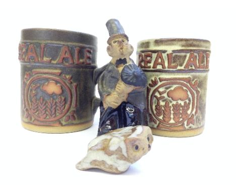 A Tremar stoneware figure modelled as a Chimney Sweep, a miniature Tremar pottery Owl and a pair of Real Ale tankards.