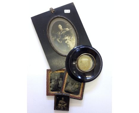 Three 19th century Daguerreotype style family portrait photographs on glass in original frames.