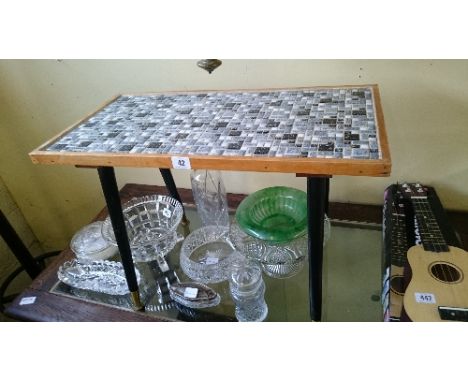 A mid 20th century tile top coffee table.