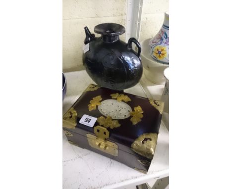 An Oriental hardwood jewellery box together with a pottery flask.