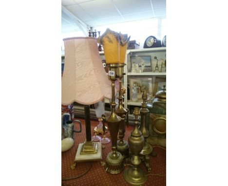 A pair of brass table lamp bases together with with two others and a brass and onyx table lamps.