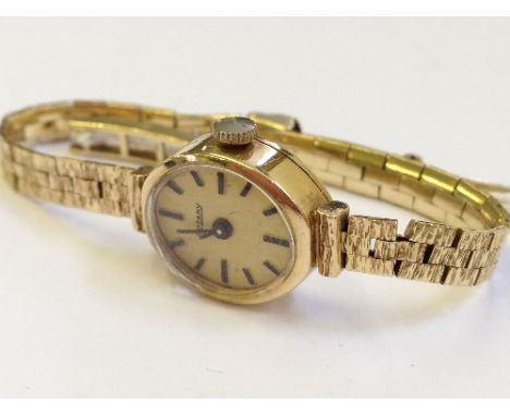 A 9 carat gold cased ladies rotary wrist watch and strap (13 grams overall).