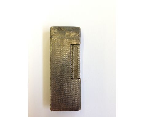 A silver plated engine turned Dunhill cigarette lighter.