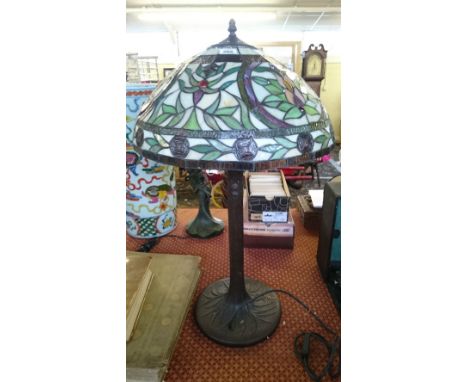 A large Tiffany style table lamp and shade.