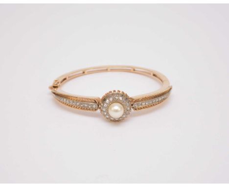 A Victorian style cultured pearl and rose cut diamond hinged bangle, designed as a raised central single cultured pearl mount