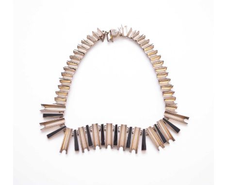 A white metal and black enamel graduated geometric inspired fringe necklace, designed as tapering black enamel bars intersper
