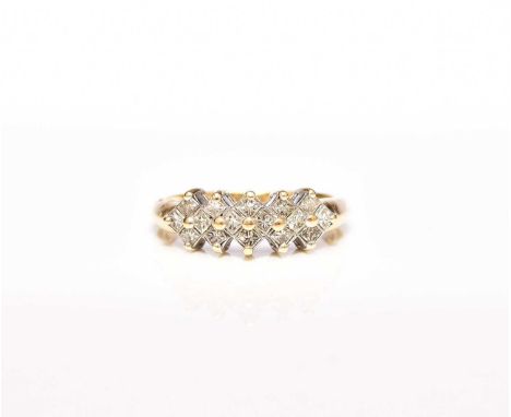 An 18ct gold diamond ring, designed as stepped clusters of square faceted diamonds claw set in yellow gold, the shank stamped