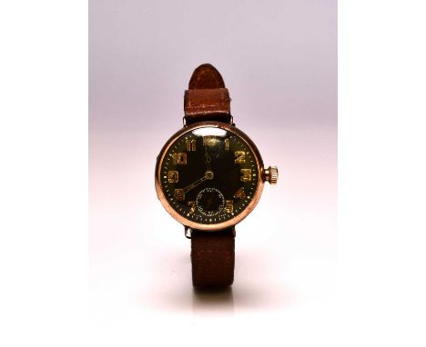 Zenith: A gentleman's 9ct gold wristwatchDate: Circa 1919Movement: Jewelled, manualDial: Black, Arabic hour markers, shaped h