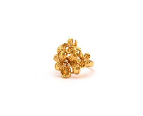 A diamond set stylised flower ring, stamped ‘22k Thailand’, ring size N 1/2, weight approx 9g
