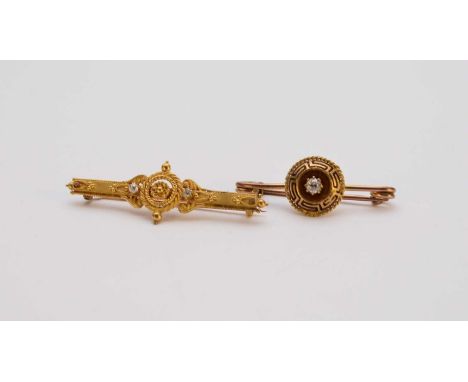 A single stone diamond bar brooch with black enamel Greek key decoration, not stamped, 36mm wide, together with a diamond set