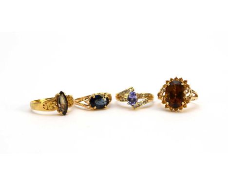 An untested green sapphire ring, stamped '18k', ring size S, together with an untested blue sapphire ring, stamped '14k', siz