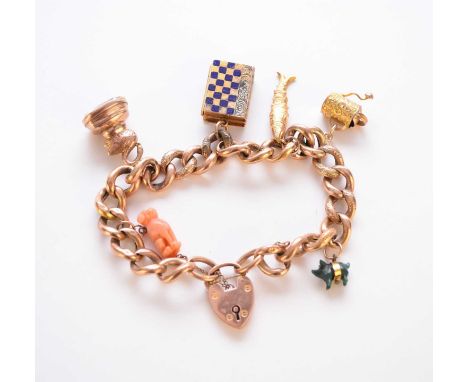 A 9ct gold charm bracelet with attached charms, the hollow curb link rose gold bracelet with heart shaped padlock clasp and a