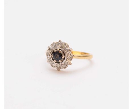 An 18ct gold sapphire and diamond cluster ring, of star and floral design, ring size N, weight approx 4gCondition:Significant