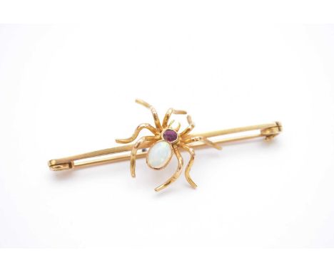 An opal and ruby spider bar brooch, the opal and ruby body mounted in yellow metal, not stamped, 63mm wide, weight approx 7.5