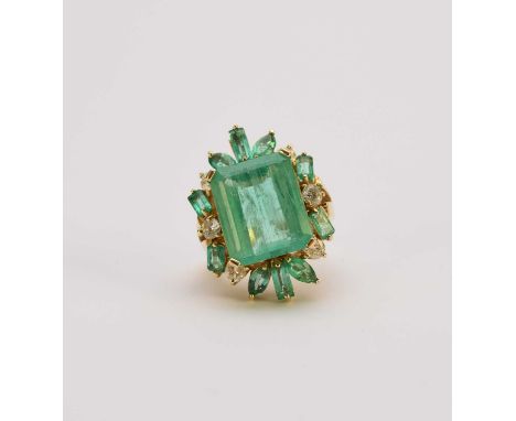 A large untested emerald and diamond dress ring, the yellow metal shank stamped ‘k14’, ring size M 1/2, weight approx 13.4g