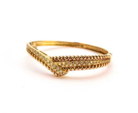 A diamond set stylised crossover hinged bangle, the graduated brilliant cut diamonds claw set to crossover mount with rope tw