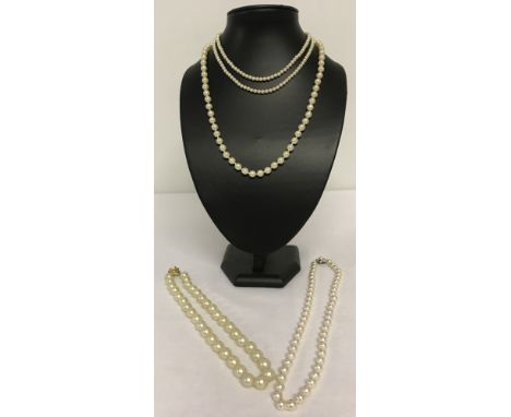 4 vintage faux pearl necklaces all with decorative clasps. One marked 925.