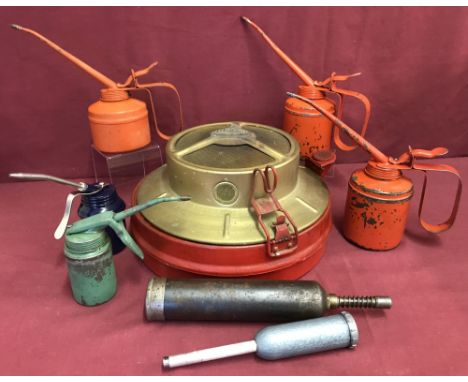 5 vintage oil cans together with 2 grease guns and an under car paraffin heater.