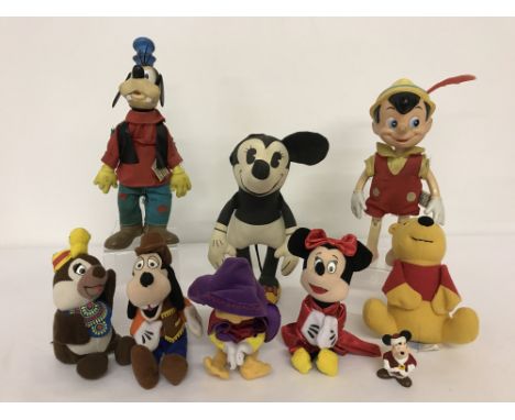 A collection of vintage Disney toys.To include: 1960's Walt Disney Distributing Co Goofy and Pinocchio and a 1980 Anne Wilkin
