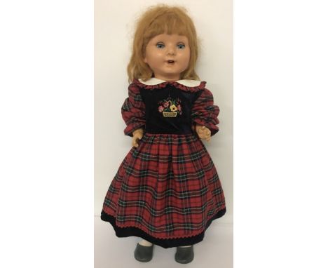 A vintage ceramic talking doll with moving eyes, open mouth showing top teeth.Talking mechanism not working.Approx  66cm tall