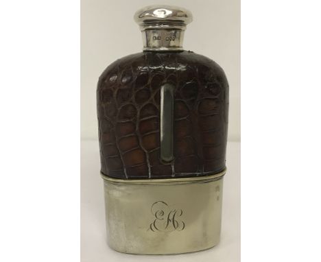 A silver-topped hip flask, hallmarked for London 1887.Maker H Titterton Brockwell. Glass inner, with crocodile leather casing