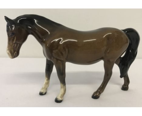 A Beswick ceramic Pony figurine (Boy's Pony) #1480, in brown colourway.With gloss finish and oval back stamp. Designed by Art