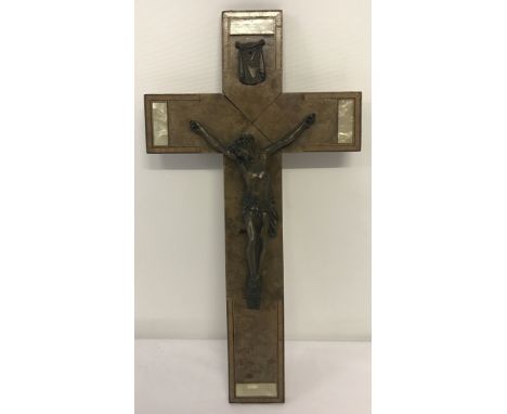 A vintage wooden wall hanging crucifix.With inlaid mother of pearl detail.Approx. 41cm x 21.5cm.