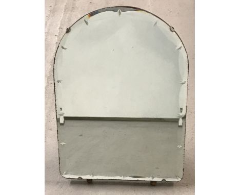 A small arch-shaped, free-standing vintage mirror.With bevelled edge and diamond decoration to rim of glass.Approx. H36 x W26