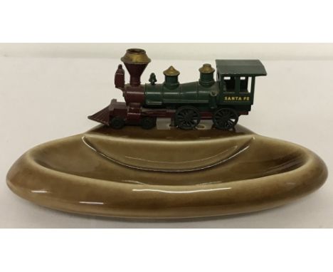 A circa 1960's Wade brown ceramic pin tray mounted with Matchbox diecast vehicle.Matchbox Yesteryear Y13-1 Santa Fe Locomotiv