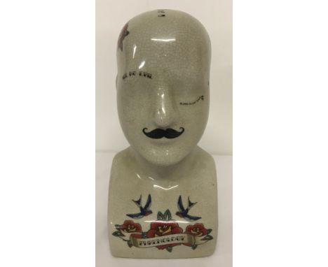 A modern ceramic phrenology head.Approx. 23cm tall.