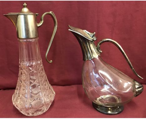 2 vintage glass and silver plate claret jugs.A tall patterned moulded glass jug with silver plate top lid and handle and a du