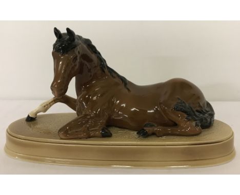 A Beswick ceramic horse figurine "Spirit of Peace" on ceramic plinth.Model No. 2916, in brown/black colourway with gloss fini