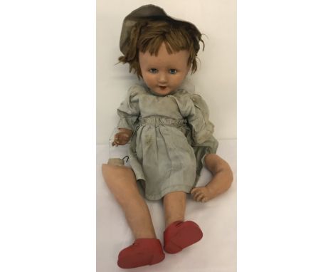 A vintage composition doll marked to back of head FP, with sleeping eyes, teeth and hair.Possibly Frank Popper, dressed in pa