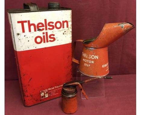 A vintage Thelson Oils 5 litre can together with an oil jug and a small pistol grip oiler can.