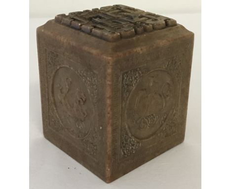 A Chinese carved soapstone seal with mythical creature detail to each side.Approx. 7cm tall.