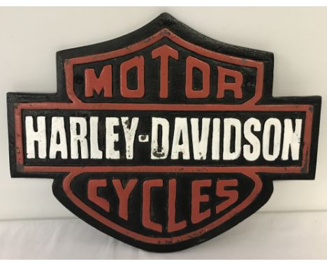 A painted cast iron Harley Davidson motorcycles wall plaque with fixing holes.Approx. 26cm x 32.5cm.