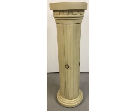 A fibreglass pedestal column in classical style.In original polychrome paint.  Contains 3 shelf interior storage space.Approx