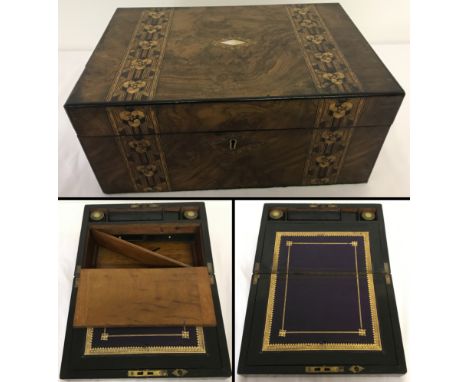 A vintage wooden writing box/slope with inlaid detail.Interior has purple and gilt leather writing slope, Parkins &amp; Gotto