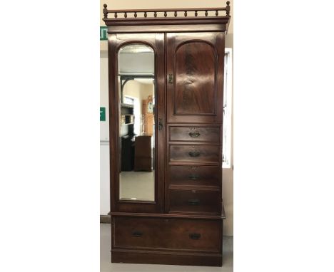 A large Victorian mahogany mirrored door tallboy wardrobe with turned final top plinth.Large base drawer with 3 other drawer 