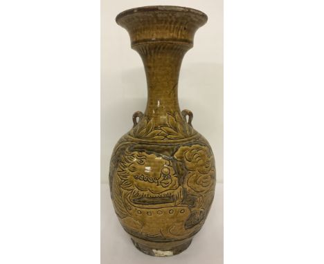 An early ceramic vase with dragon design to bowl, in yellow/brown glaze.Approx. 29.5cm tall.