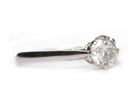 DIAMOND SOLITAIRE RINGthe eight claw set round brilliant cut diamond of approximately 0.85 carats, hallmarks worn, size R, 2.