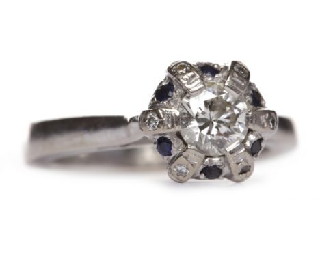 DIAMOND SOLITAIRE RINGthe round brilliant cut diamond of approximately 0.36 carats within a blue gem set border, in eighteen 